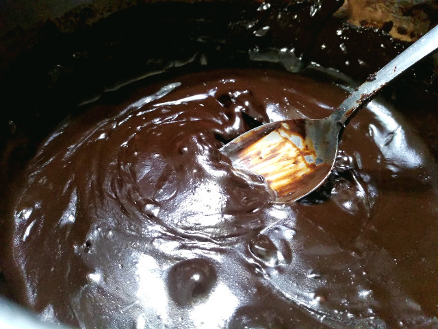 Warm  chocolate fudge in a pot.